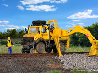 Kibri H0 - 16307 - H0 Zweiwege UNIMOG mit Heckbagger